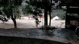 Buildings washed away as heavy rain causes flash floods in Malaysia
