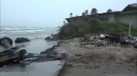 Large sea waves brought by storm batter homes along coast of southern Thailand