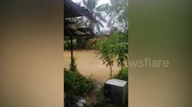 Floods batter village after heavy rain in Malaysia