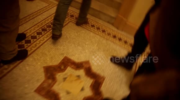 A Stop The Steal Rally Protester Attempts To Break Down Door at United States Capitol on January 6th, 2021