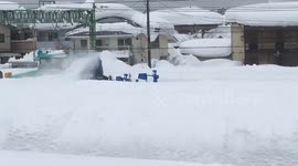 Watch this snow-blowing machine in action as it clears path along submerged Japanese road