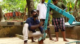 Father becomes local star after making DIY digger from waste for his two sons