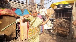 85-year-old woman in India performs traditional martial arts in the street to make a living
