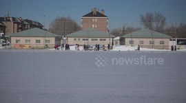 Rayo Majadahonda asks his supporter for help, hands and shovels to remove the snow from the football field in Madrid 13rd January, 2021.