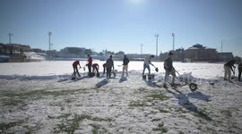 Rayo Majadahonda asks his supporter for help, hands and shovels to remove the snow from the football field in Madrid 13rd January, 2021.