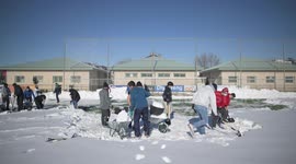 Rayo Majadahonda asks his supporter for help, hands and shovels to remove the snow from the football field in Madrid 13rd January, 2021.