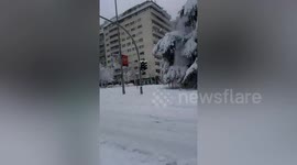 Residents enjoy snow-covered street in Madrid, Spain