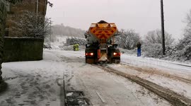 Snowy conditions send gritter drifting up steep hill in West Yorkshire