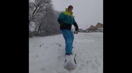 Slopes are closed? SNOW problem! Man ski's through streets of Leeds