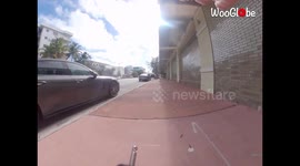 Guy Riding An Electronic Unicycle Almost Hit By Police Office, Close Call