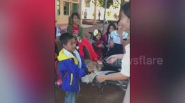 Schoolboy from poor Vietnamese family gifts a chicken to his teacher