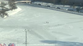 Children skating on a frozen river in Minsk, Belarus