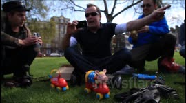 Cancer patient Artist Taxi Driver pushes toy pig  to Downing Street to protest NHS privatisation