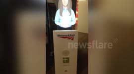 Weird holographic woman at London Underground station