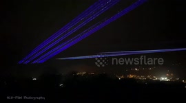 Laser show above Newtown for Christmas lights turn on due to Covid 19.