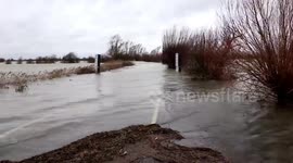 Floodwaters from Storm Christoph close roads and leave vast areas of the Fens submerged