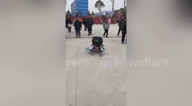 Excited 10-year-old shows off kung fu moves at school gate as winter holidays start