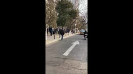 Long lines form as Beijing begins mass testing for COVID-19