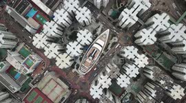 Mesmerising drone footage shows incredible patterns of Hong Kong rooftops complete with BOAT right in the middle of the city