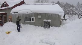 Snow plunges from garage roof as man clears driveway in Japan
