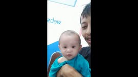 My baby boy watch her cousin singing