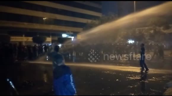 Police fire water cannon at anti-lockdown protesters in Tripoli, Lebanon