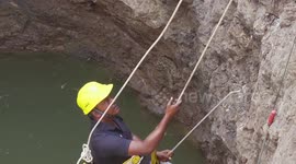 Heroic effort to save three deadly vipers which fell into deep well while mating