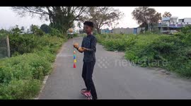 Boy shows off his crazy skills by juggling while riding Waveboard
