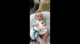 Baby disgusted with dad burping in his face.