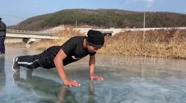 Residents play on frozen river in South Korea