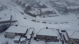 Aerial drone footage of Buttershaw Estate in Bradford, West Yorkshire, UK showing local roads ungritted. Temperatures were minus 3 Celsius