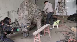 Chinese men create 12 Chinese zodiac animals out of abandoned tyres