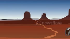 A truck passes through the desert