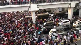 Myanmar protesters surround police trucks at march against military coup