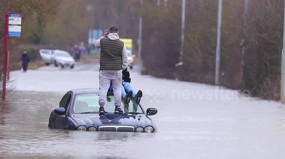 Motorist becomes stranded while trying to cross a flooded road in Yorkshire