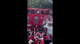 Buccaneers fan launches beer at team's boat during parade for players to celebrate