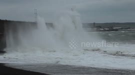 Ferocious waves crash over seawall of town in Cornwall, UK