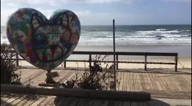 People walking with heart balloons, very soon it will be Valentine's Day.
