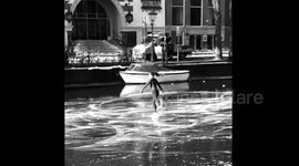 Netherlands: Ice Skating Fun On Frozen Canal In Amsterdam