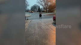 A teenager ice skates on roads around her neighbourhood