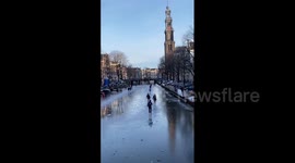 Netherlands: Ice Skating Fun On Frozen Canal In Amsterdam 3