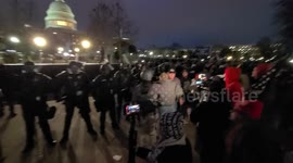 Police hold line with United States capitol in background