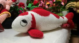 Elderly Chinese couple knit have been knitting artwork for over 10 years