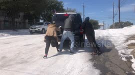 Pedestrians lend motorists a push