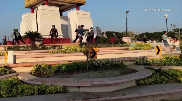 Myanmar police beat unarmed civilian during peaceful protest