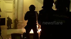 Fires lit and projectiles launched as riots break out in Madrid over rapper's arrest