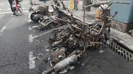 Charred motorcycles on streets of Barcelona after clashes erupt over rapper's arrest
