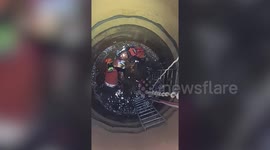 Repairman needs rescuing after falling into 50ft water tank