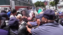 Police use stun grenades to disperse protesters opposing gentrification in historic Cape Town neighbourhood