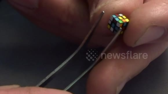 Man creates and solves 5.6mm world's smallest Rubik's Cube puzzle